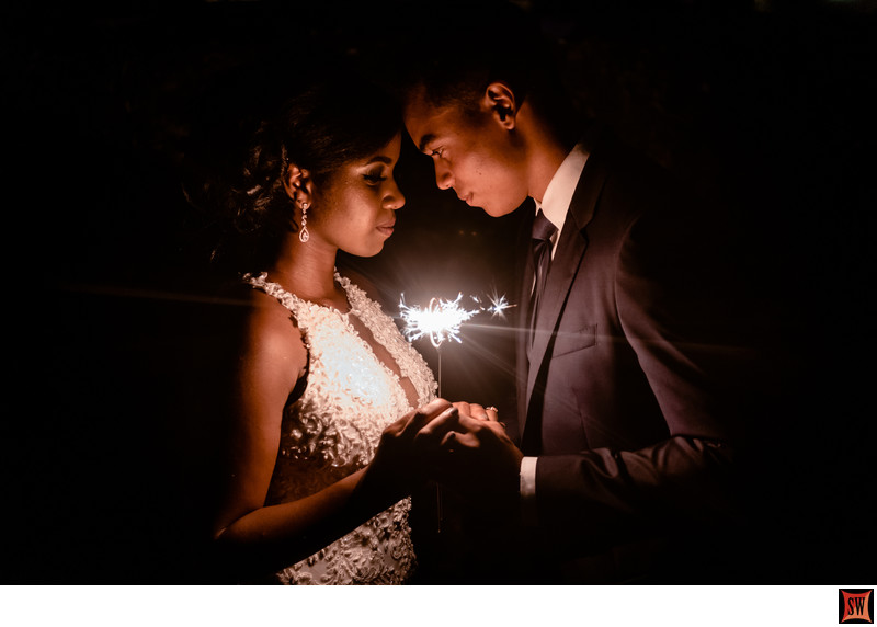 couple holding sparkler