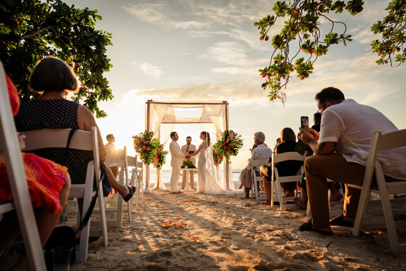 Wedding couple at sunset on the cliffs of Negril, Jamaica by Michael Saab