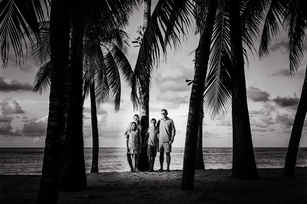 Montego Bay family photo of four and palm trees
