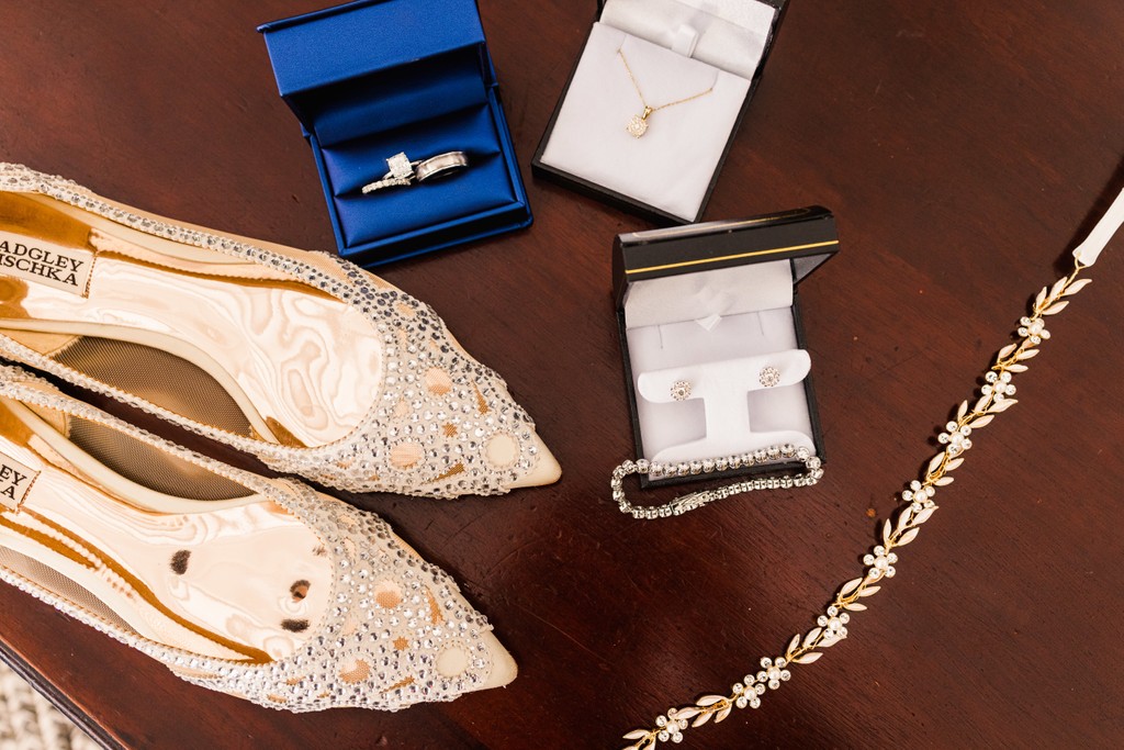 wedding detail of shoes rings, bracelet and necklace