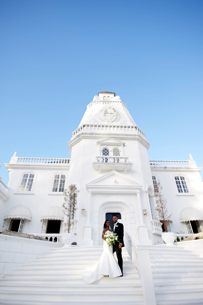 The Trident Castle rising above the Port Antonio coastline, Jamaica