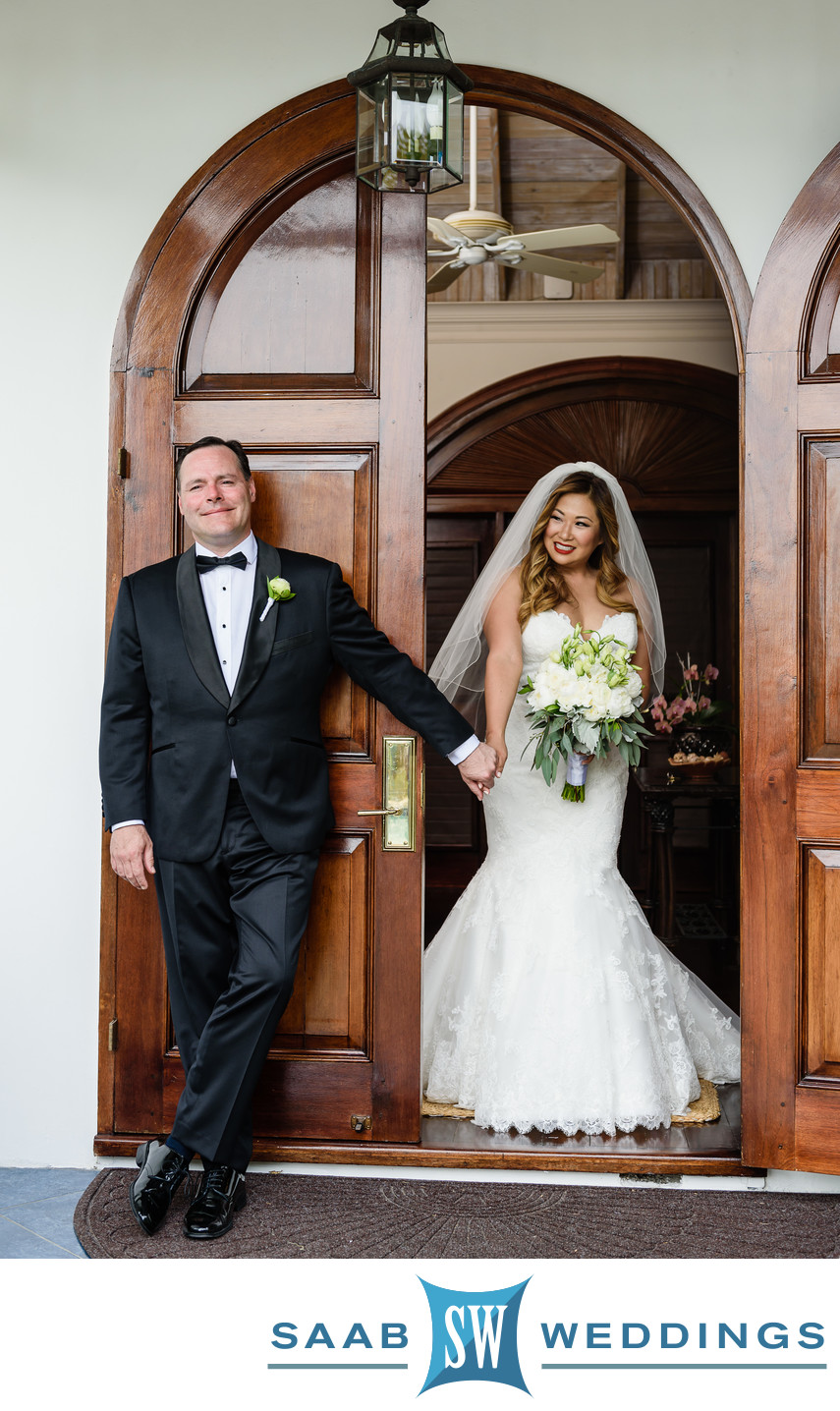 bride and groom holds hands at first look