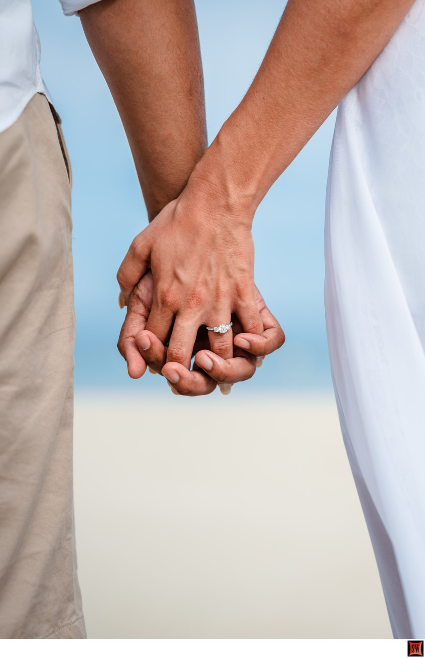 hands showing engagement ring