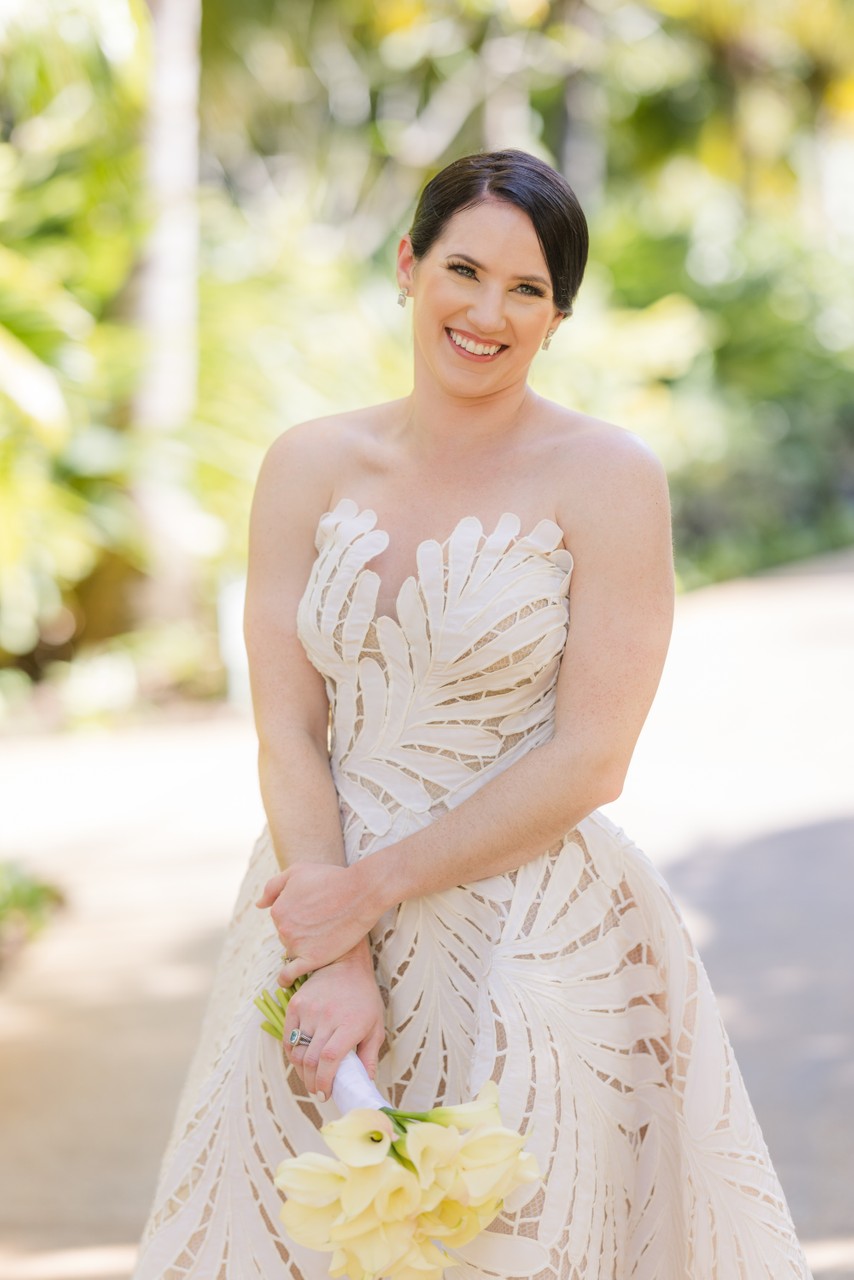 bride looks at camera and smiles beautifully