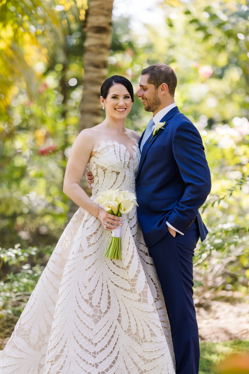 bride and groom stand tall 