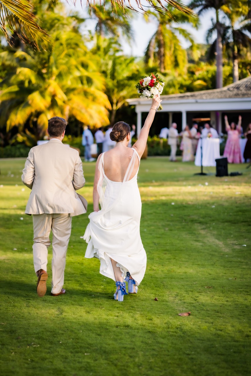 celebration after the wedding ceremony as couple walks