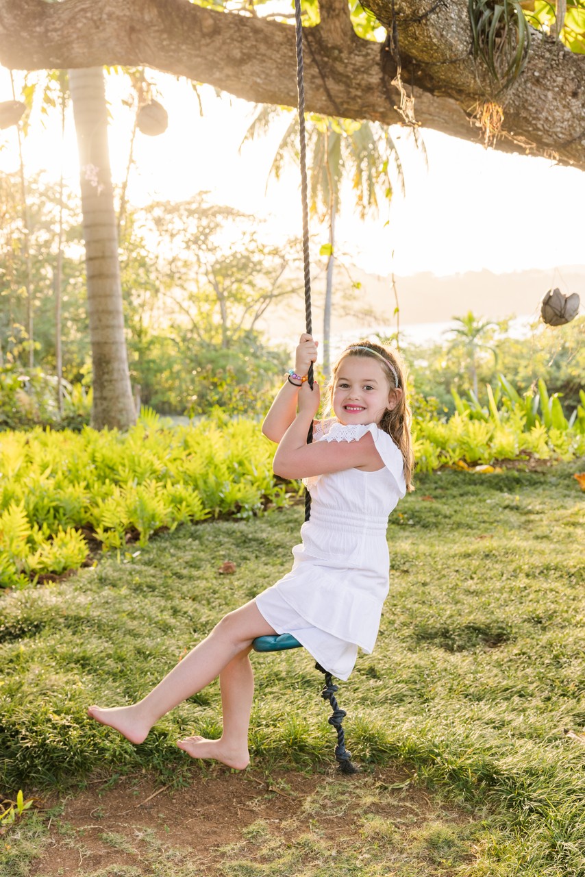 girl on swing at pimento hill house