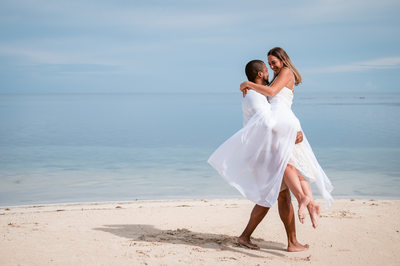 playful beach engagement photo