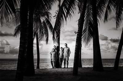 Montego Bay family photo of four and palm trees