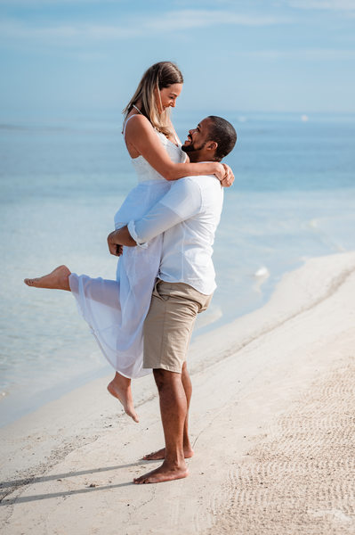 lifted on the beach engagement photo