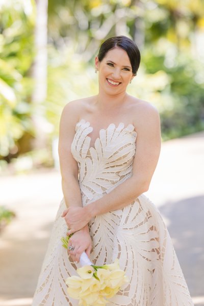 bride looks at camera and smiles beautifully