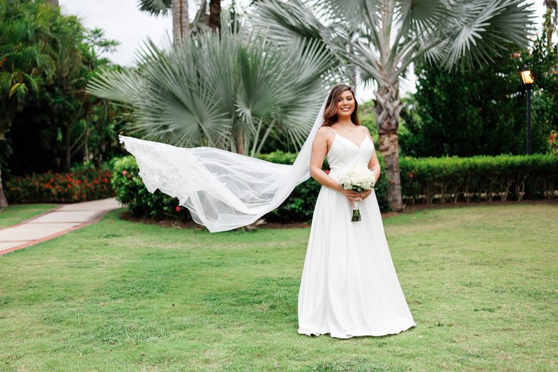 Bride's veil flowing in the ocean breeze during a Jamaica beach wedding