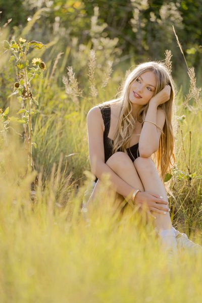 Golden Hour senior portrait in sunflower field