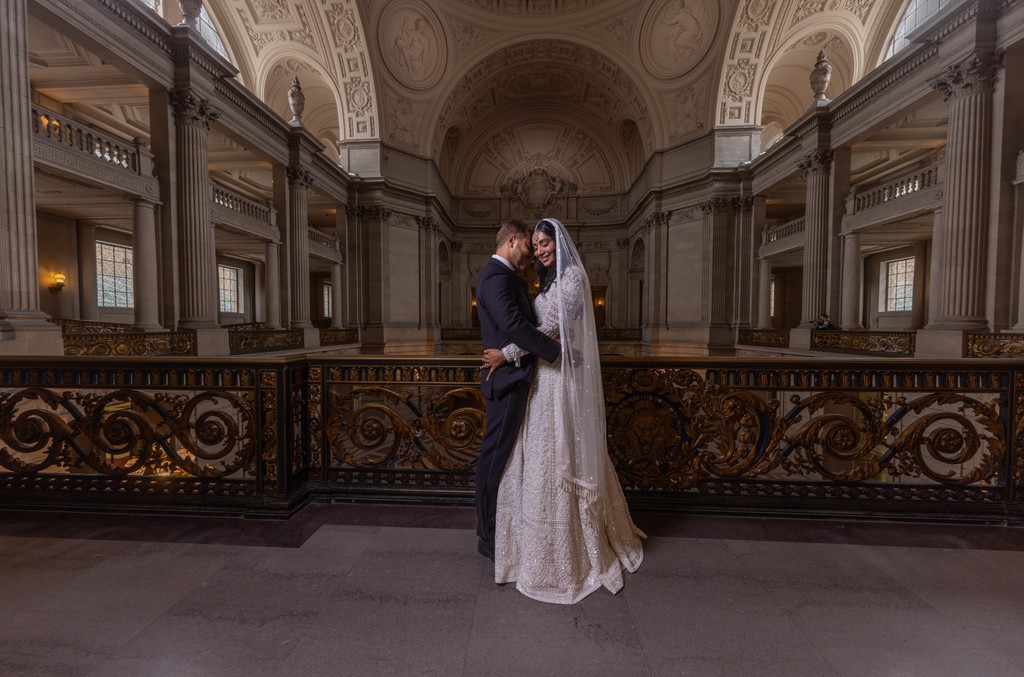 Cinematic Bride and Groom Portrait on the Grand Staircase at San Francisco City Hall
