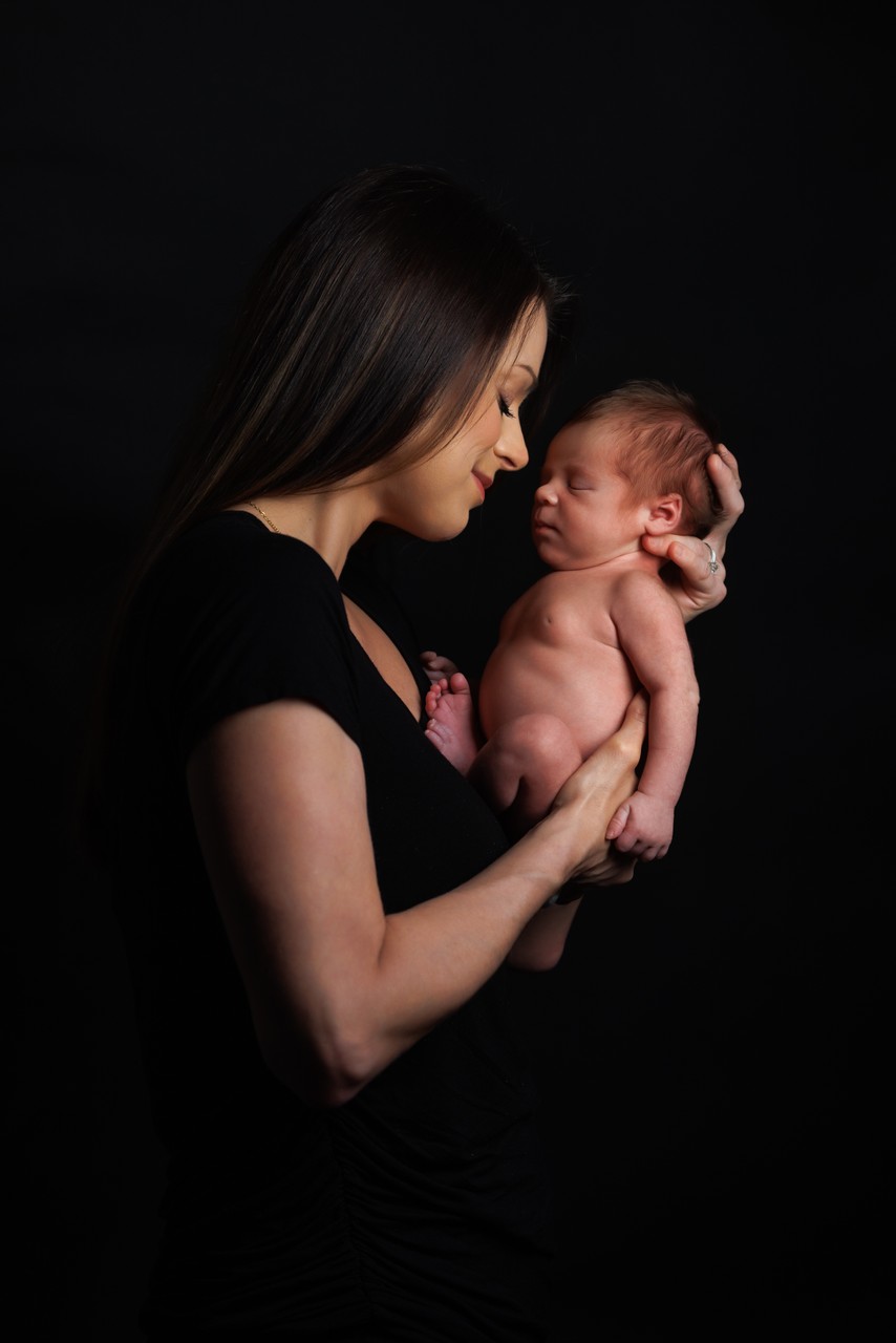 Romantic Maternity Couple Portrait with a Pink Studio Backdrop in Dublin, California