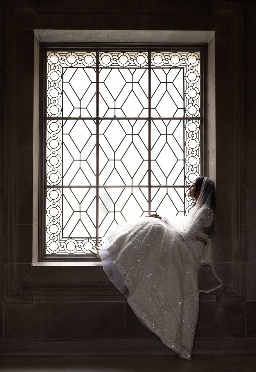 Elegant San Francisco City Hall Bride Sitting in a Grand Window
