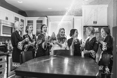 Wente Wedding Champagne popping bridal party photograph