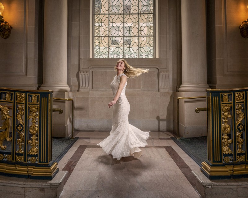 Joyful Bride Twirling in Elegant Grand Hall
