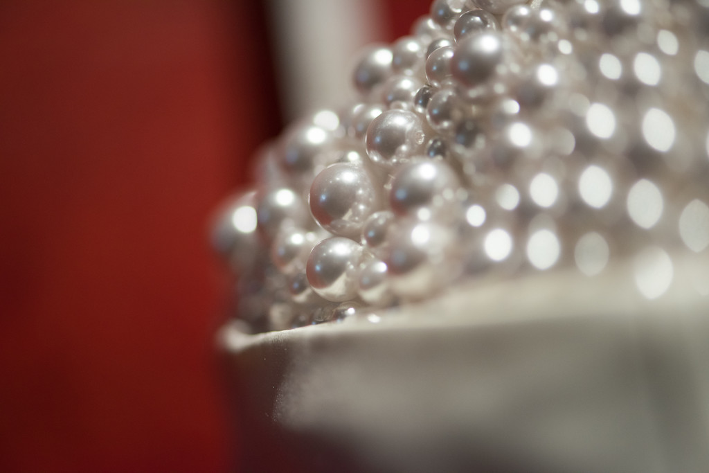 Elegant White Pearls on Red Background