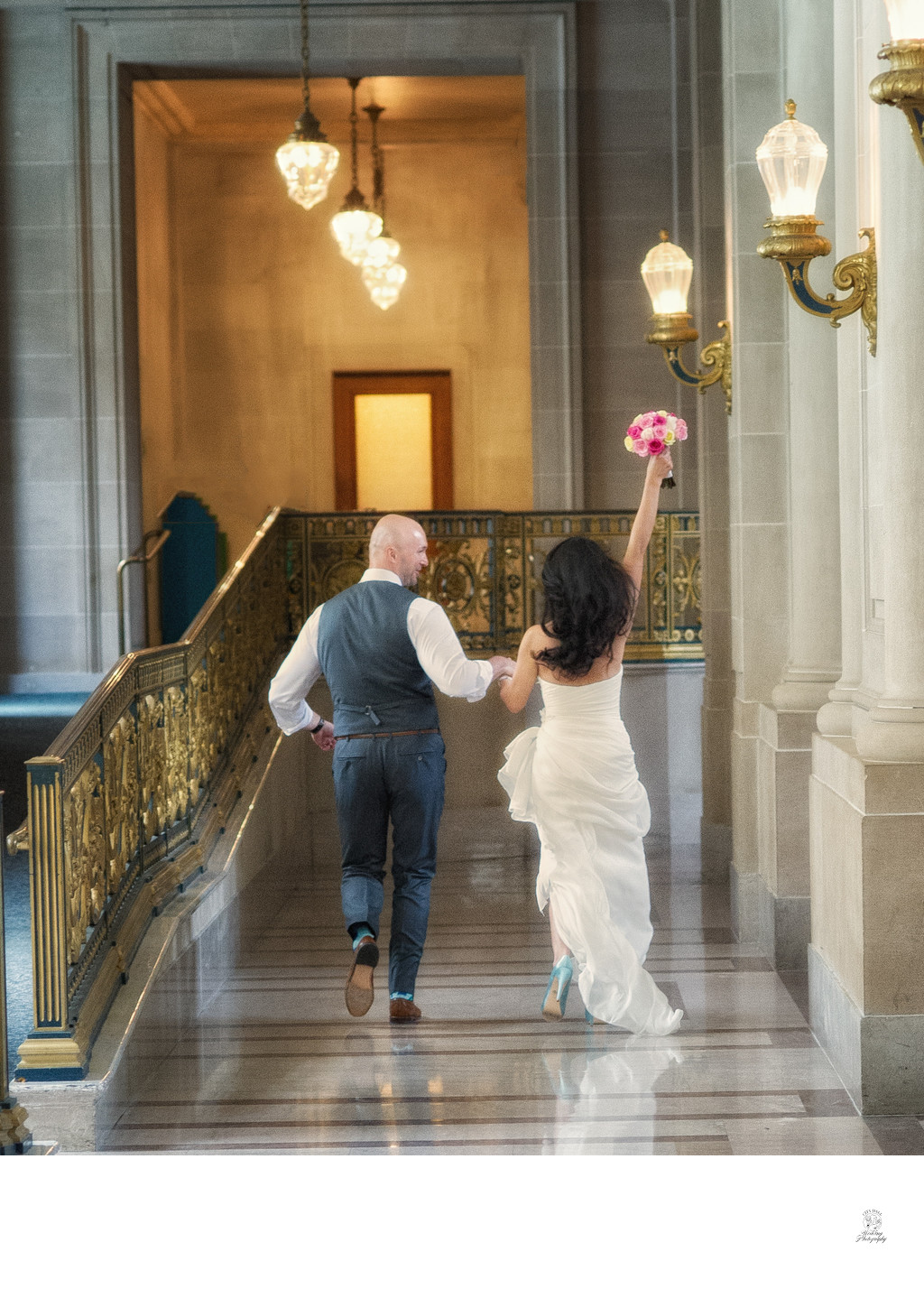 Photo of Couple having fun - just married at city hall | San Francisco City Hall Wedding Photography

