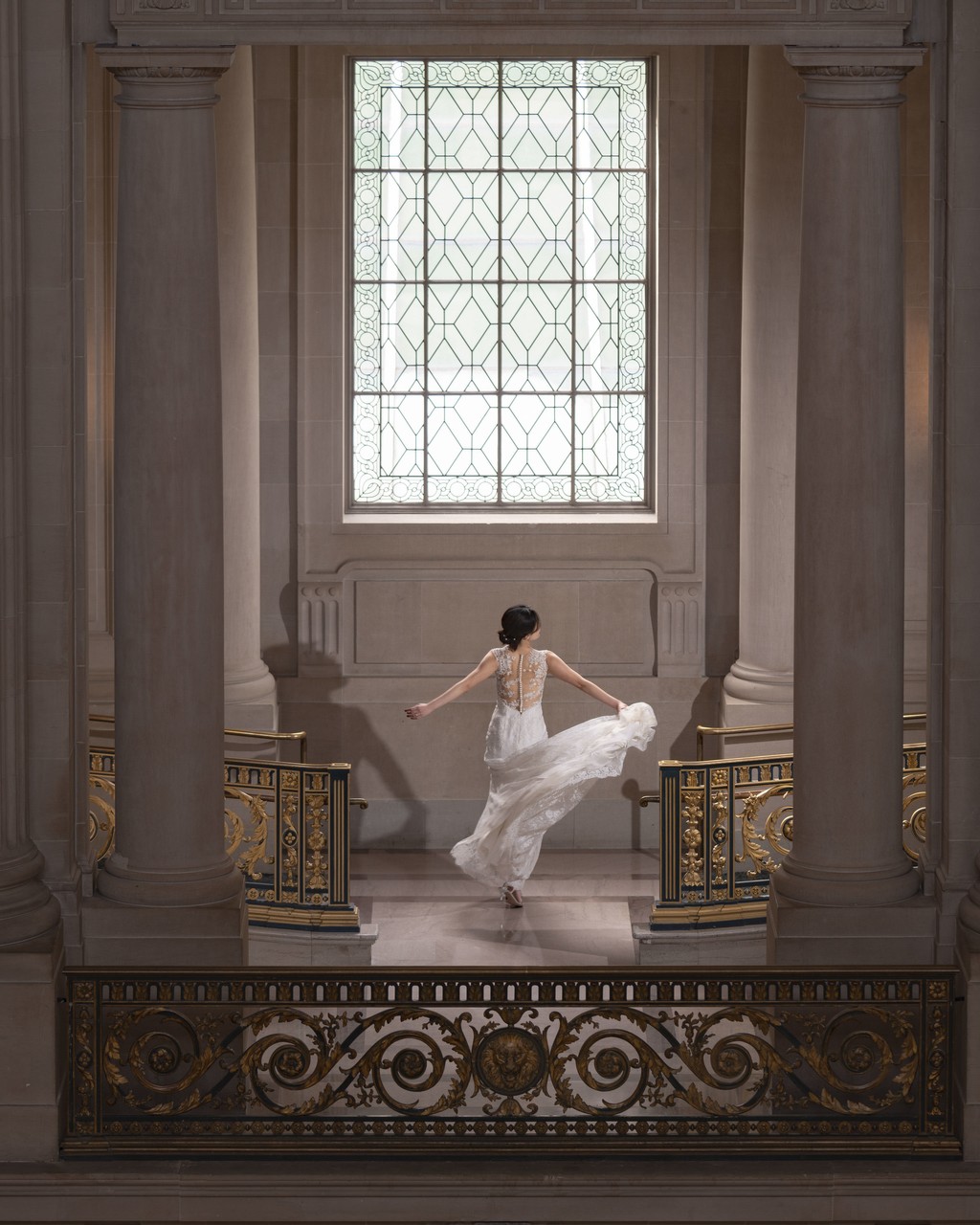 Dancing bride  Graceful Pose by Ornate Stairway & Window