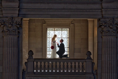 Romantic Window Frame: Bride & Groom's Tender Moment