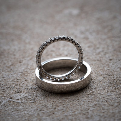 Silver Wedding Bands on Textured Surface with Diamonds