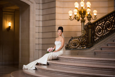 Elegant Bride Sitting at the Grand Staircase of SF City Hall - San Francisco City Hall Wedding Photographer
