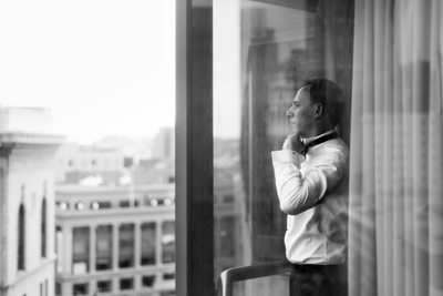 Groom Adjusting Bow Tie at Fairmont Hotel Wedding