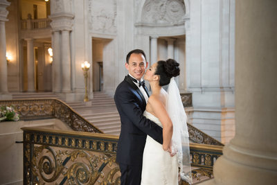 Newlywed Romance on Elegant Staircase by Ken Mendoza
