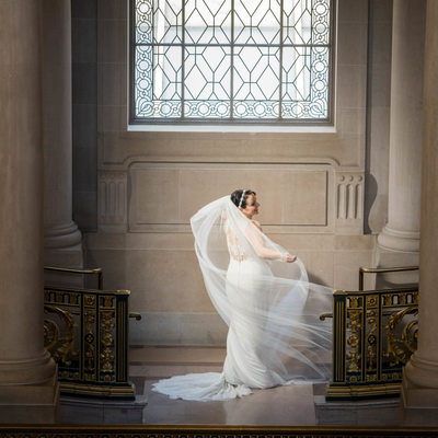 Elegant Bride on Grand Ornate Staircase