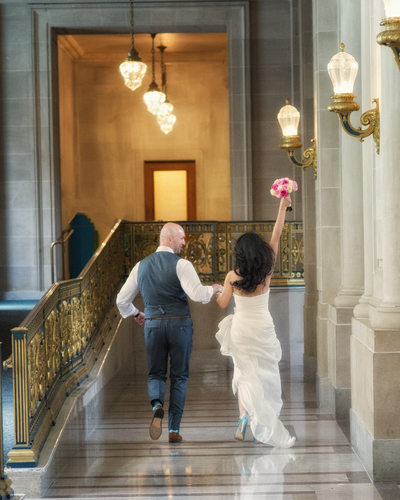 Photo of Couple having fun - just married at city hall | San Francisco City Hall Wedding Photography
