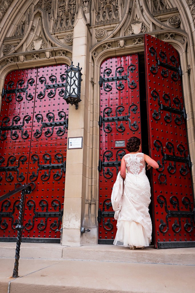 Bride entering Heinz Chapel Red Doors
