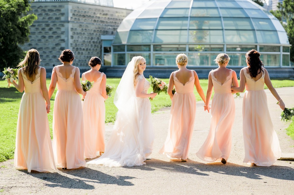 bridesmaids in peach at phipps summer wedding