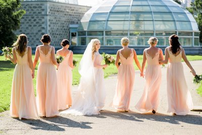 bridesmaids in peach at phipps summer wedding
