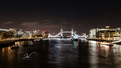 Tower Bridge at night viewed from London Bridge. 