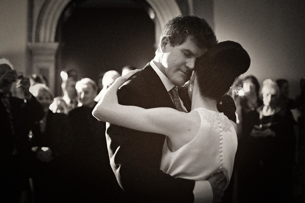 Emotional image of a bride and groom during their first dance at Hampton Court House
