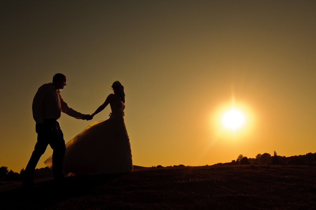 Bride and Groom with a sunset on their wedding day