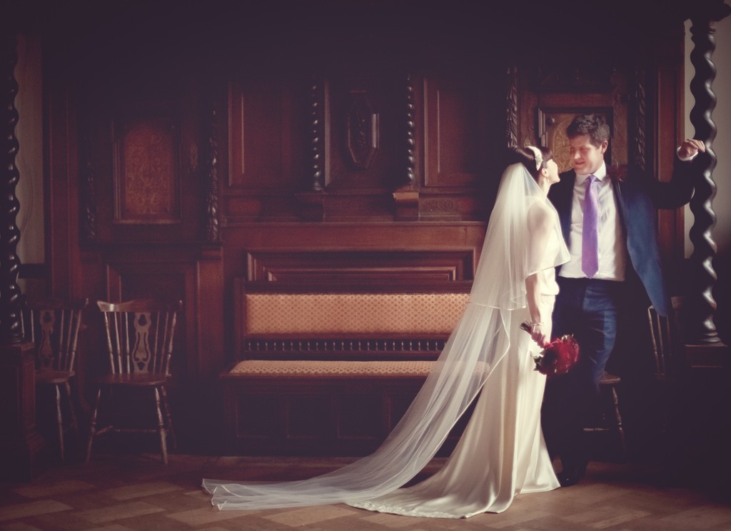Bride and Groom In natural window light at Hampton Court House