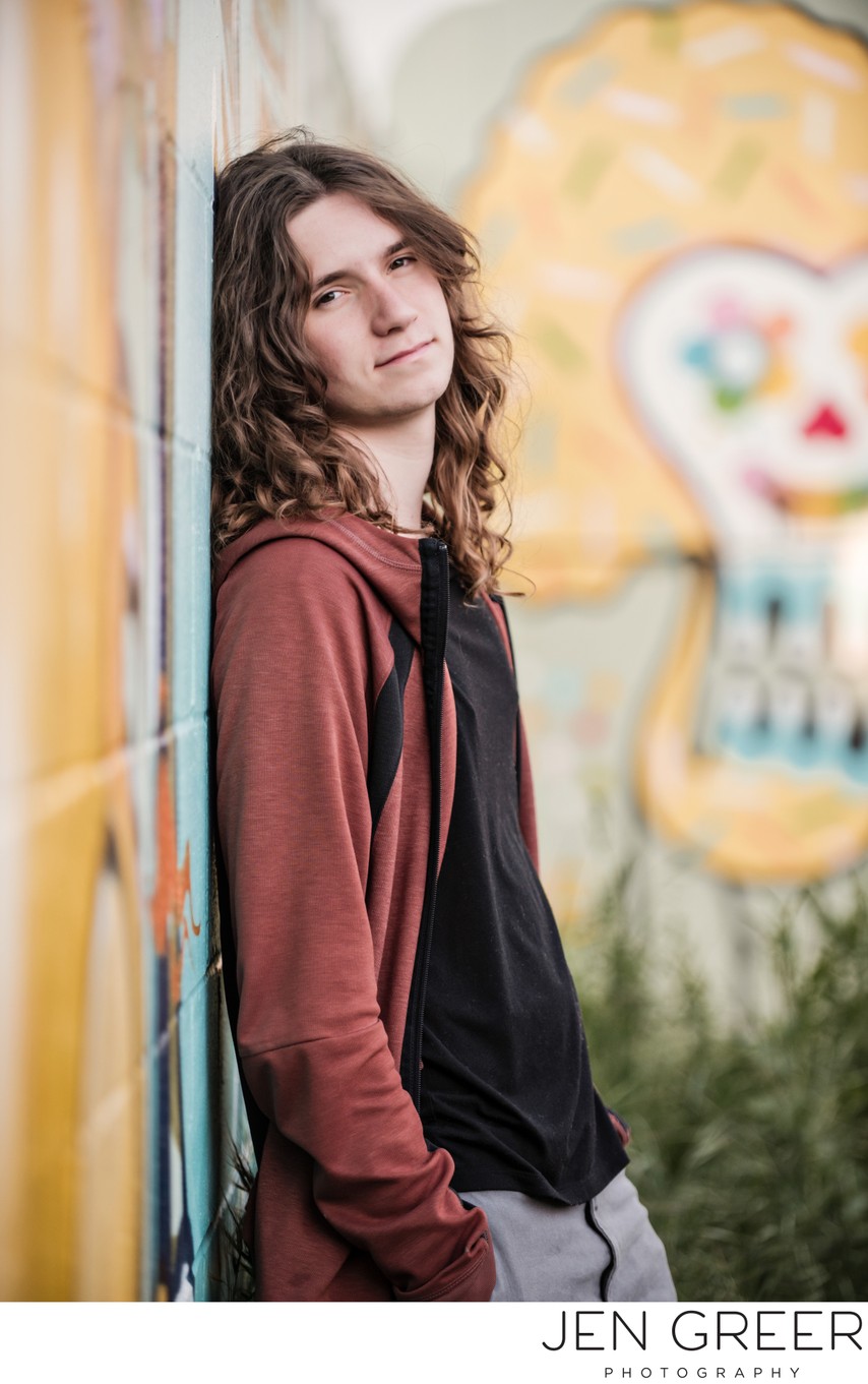Senior with graffiti wall
