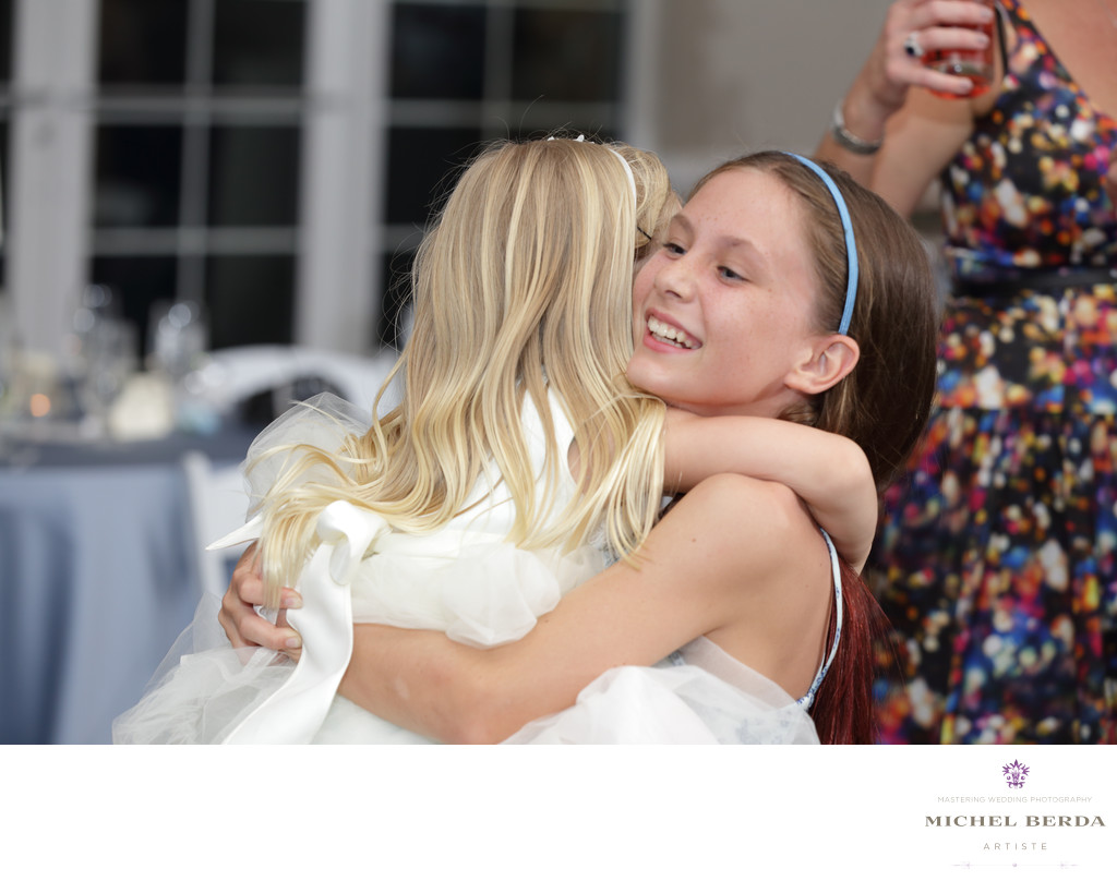 Flower girl dancing with friend at Palmetto Hall Wild Dunes Resort