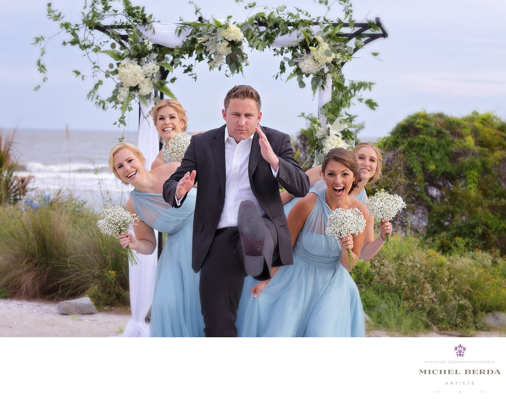 Groom with bridesmaids wedding ceremony at Sea Side Point Wild Dunes Resort