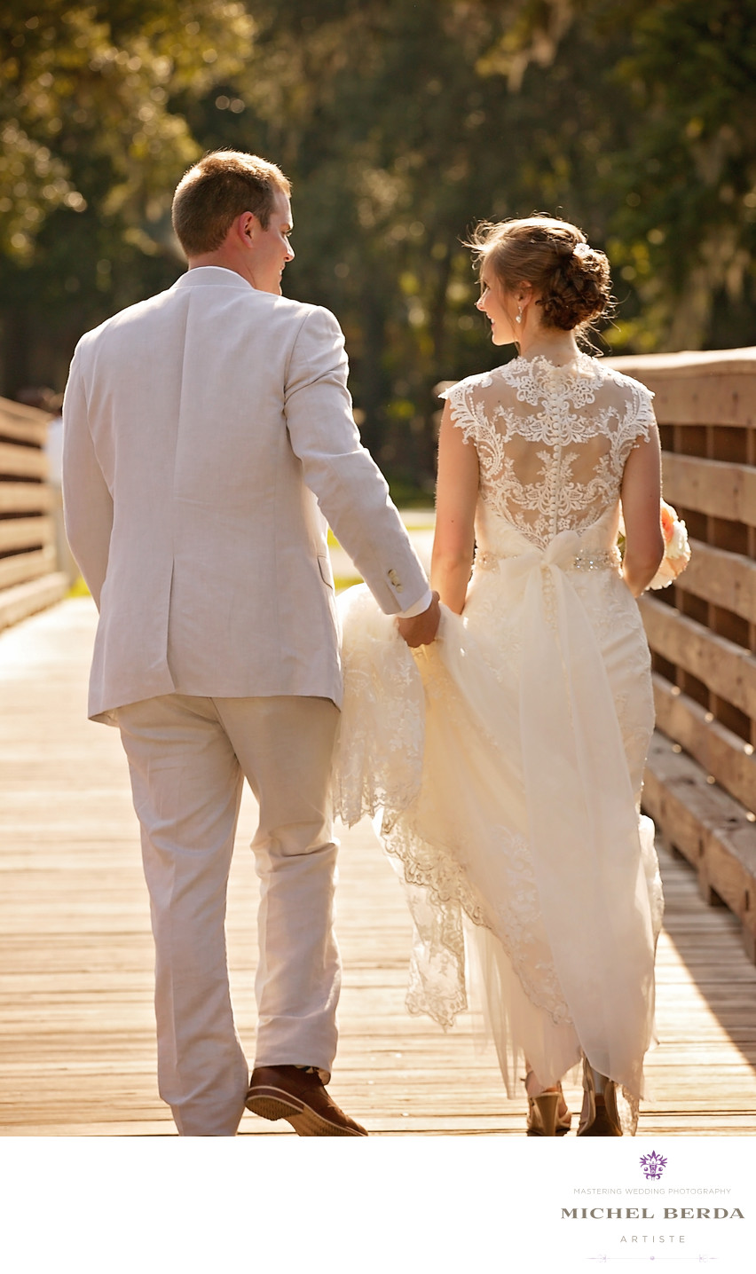 Bride and groom walking Weddings Palmetto Dunes Oceanfront Resort