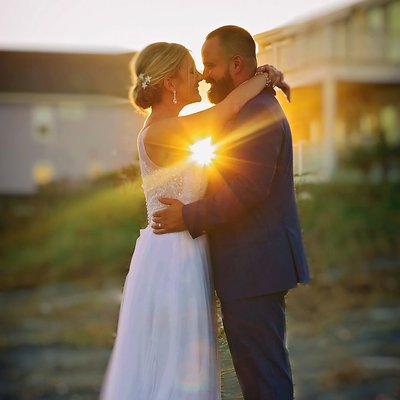 A wedding couple with the perfect sunset photo.