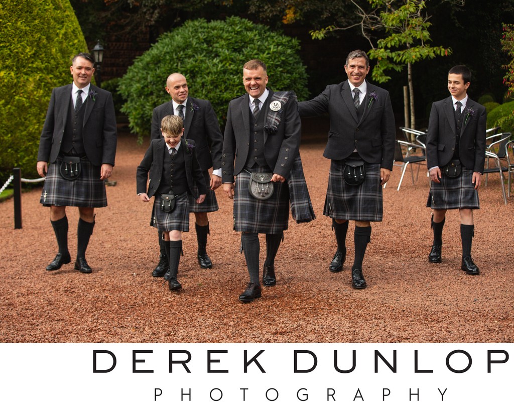 Groomsmen walking Brig o Doon gardens