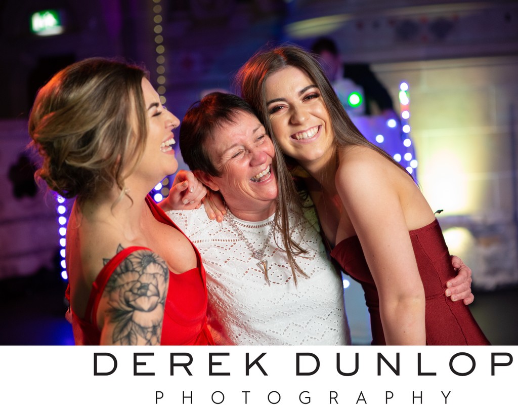 Guests laughing on dance floor - Cottiers wedding