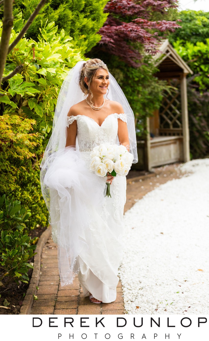 Bride walking at her wedding at Fairfield house hotel