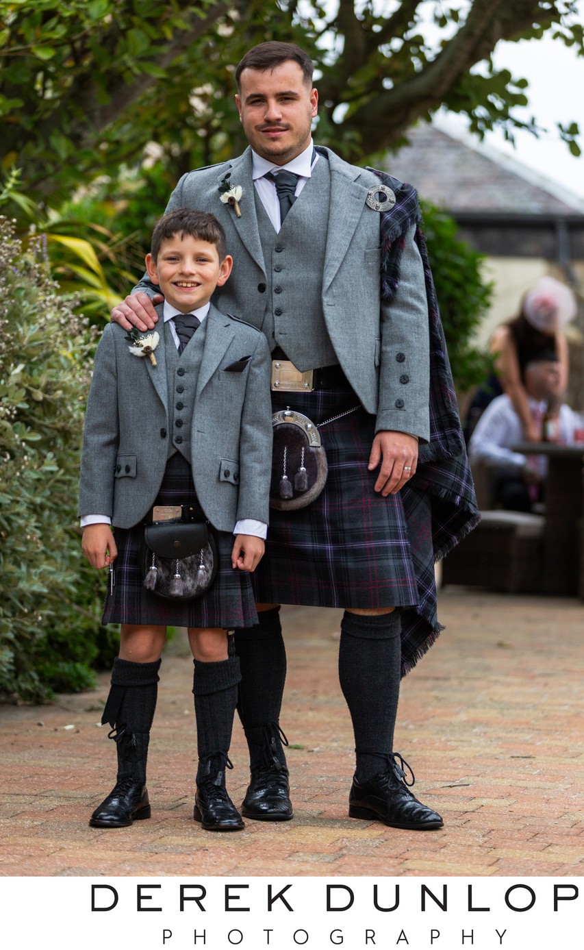 groom and family wedding photo outside at Fairfield house hotel