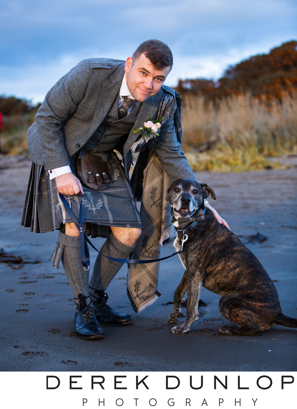 Groom and dog Troon beach wedding