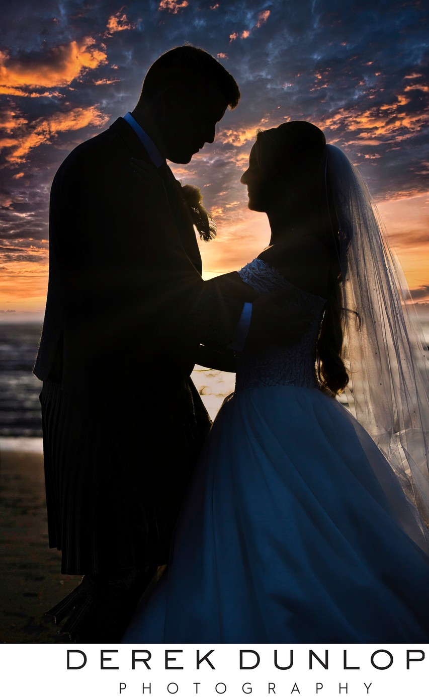 Sunset silhouette wedding couple Troon beach
